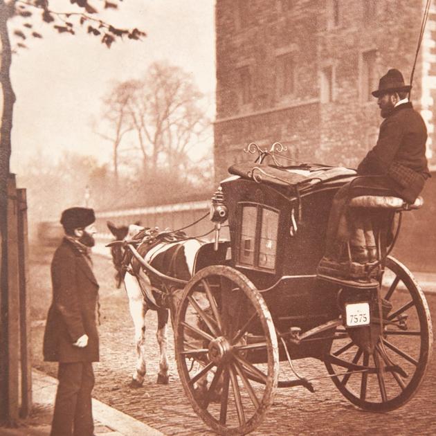 A black cab looks very different in 1877 as it patrols the London streets looking for customers. (SWNS)